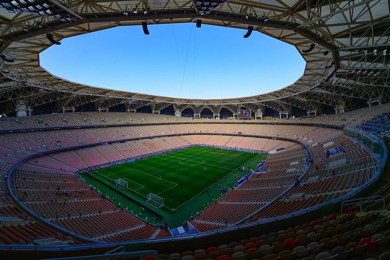 The interior bowl of Alinma Stadium seen from the upper tier, showing all three rings of seating