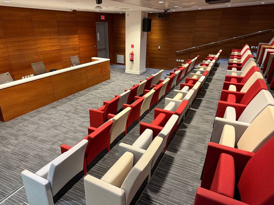 The conference room seen from the rear, looking down toward the officials' table