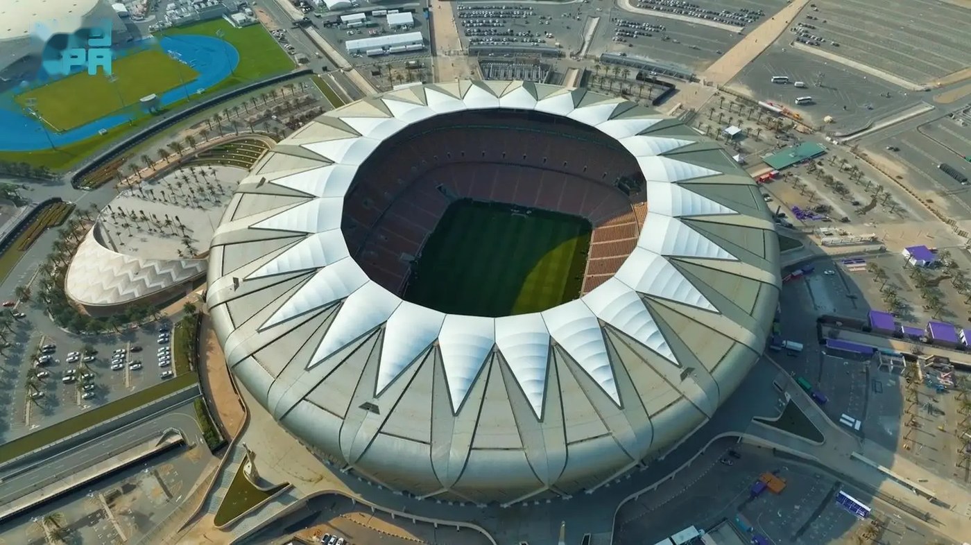 Aerial view of the circular King Abdullah Sports City estate, with the athletics track and training grounds alongside the main stadium