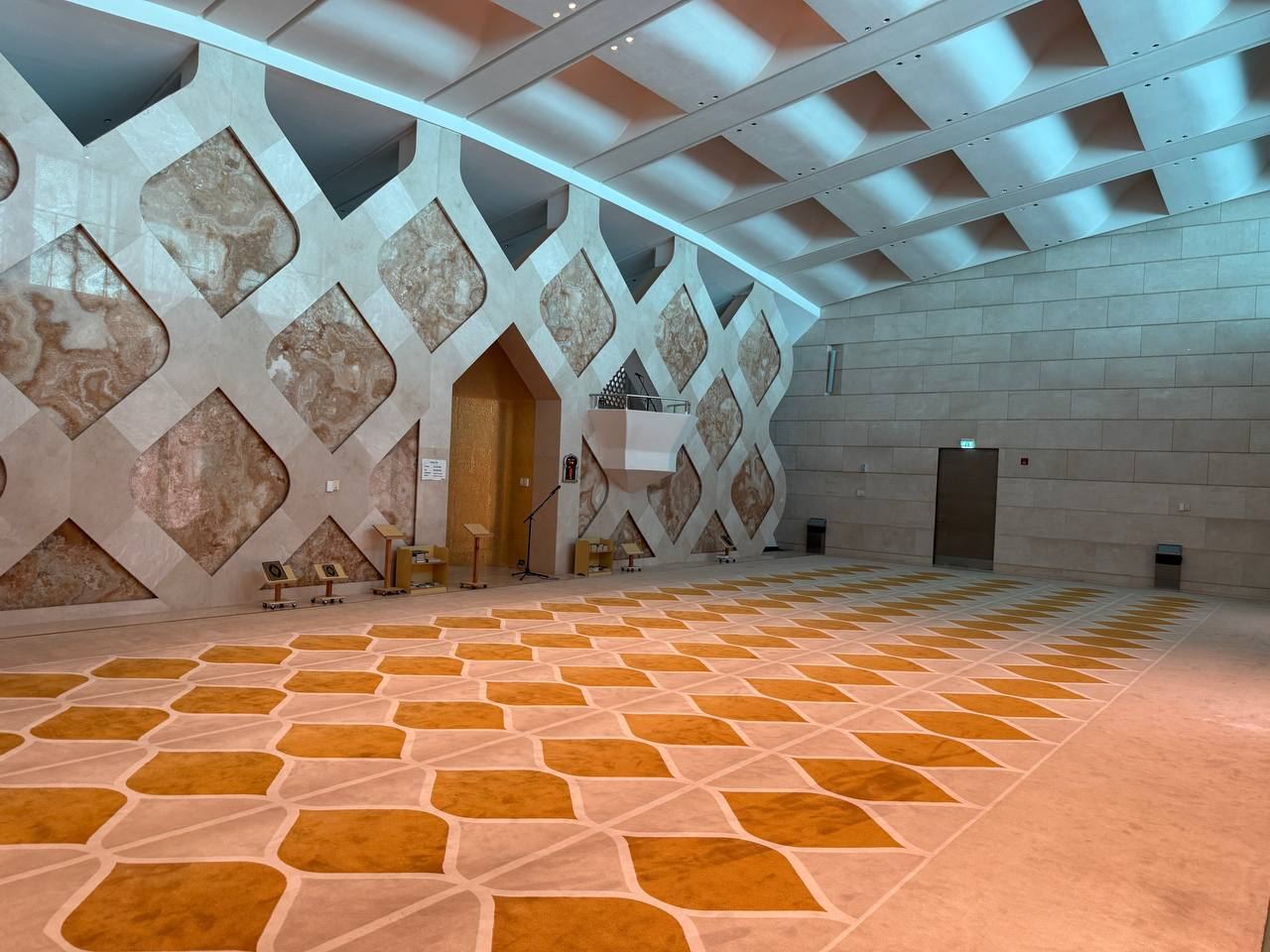 The mosque prayer hall, showing the mihrab and the onyx lattice wall