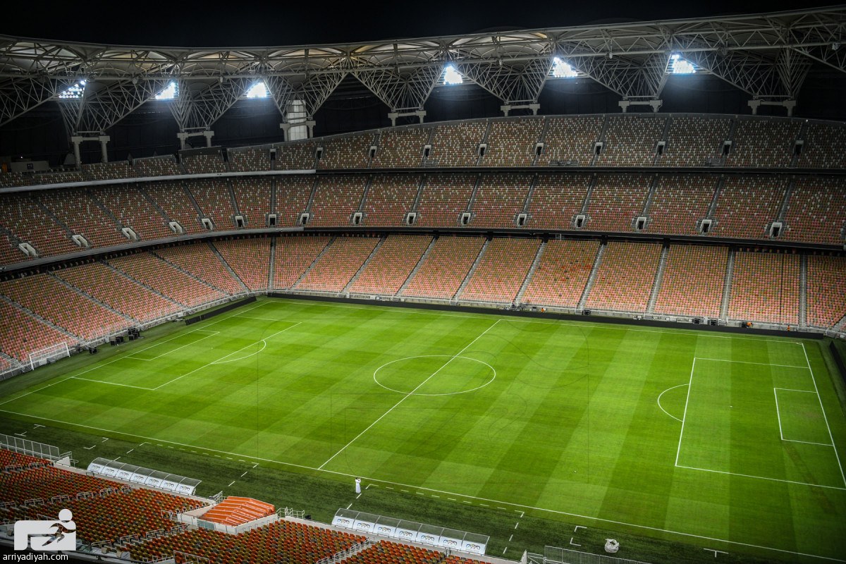 The FIFA-standard natural grass pitch inside Alinma Stadium