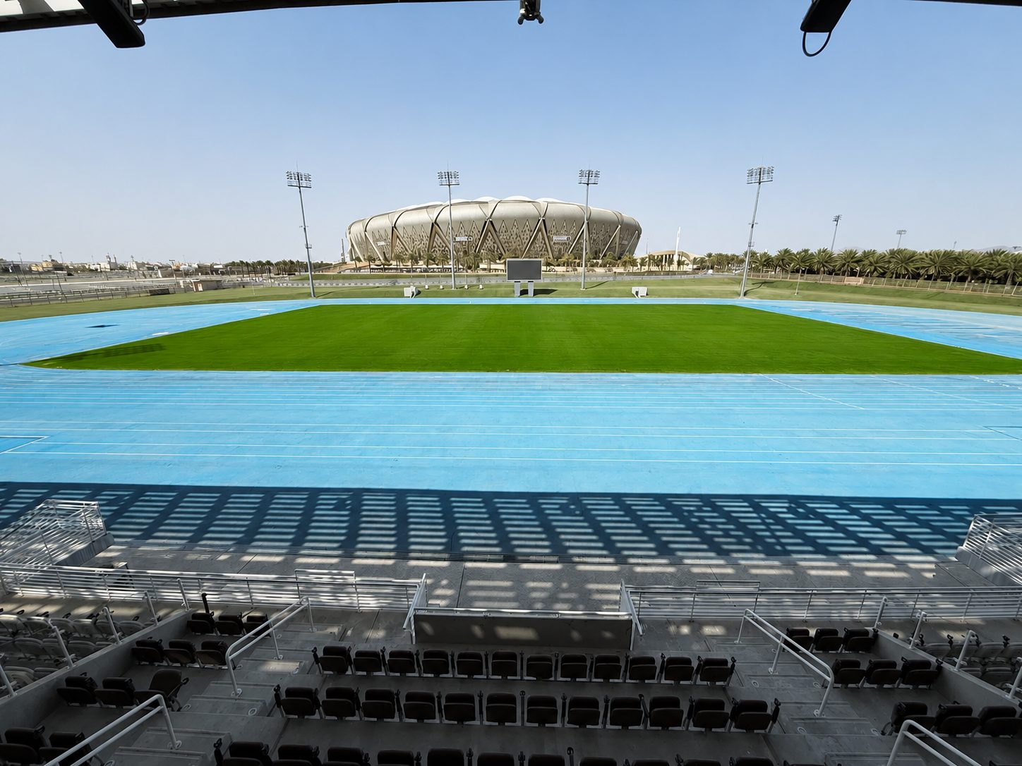 The running track and natural-grass infield seen from the main stand